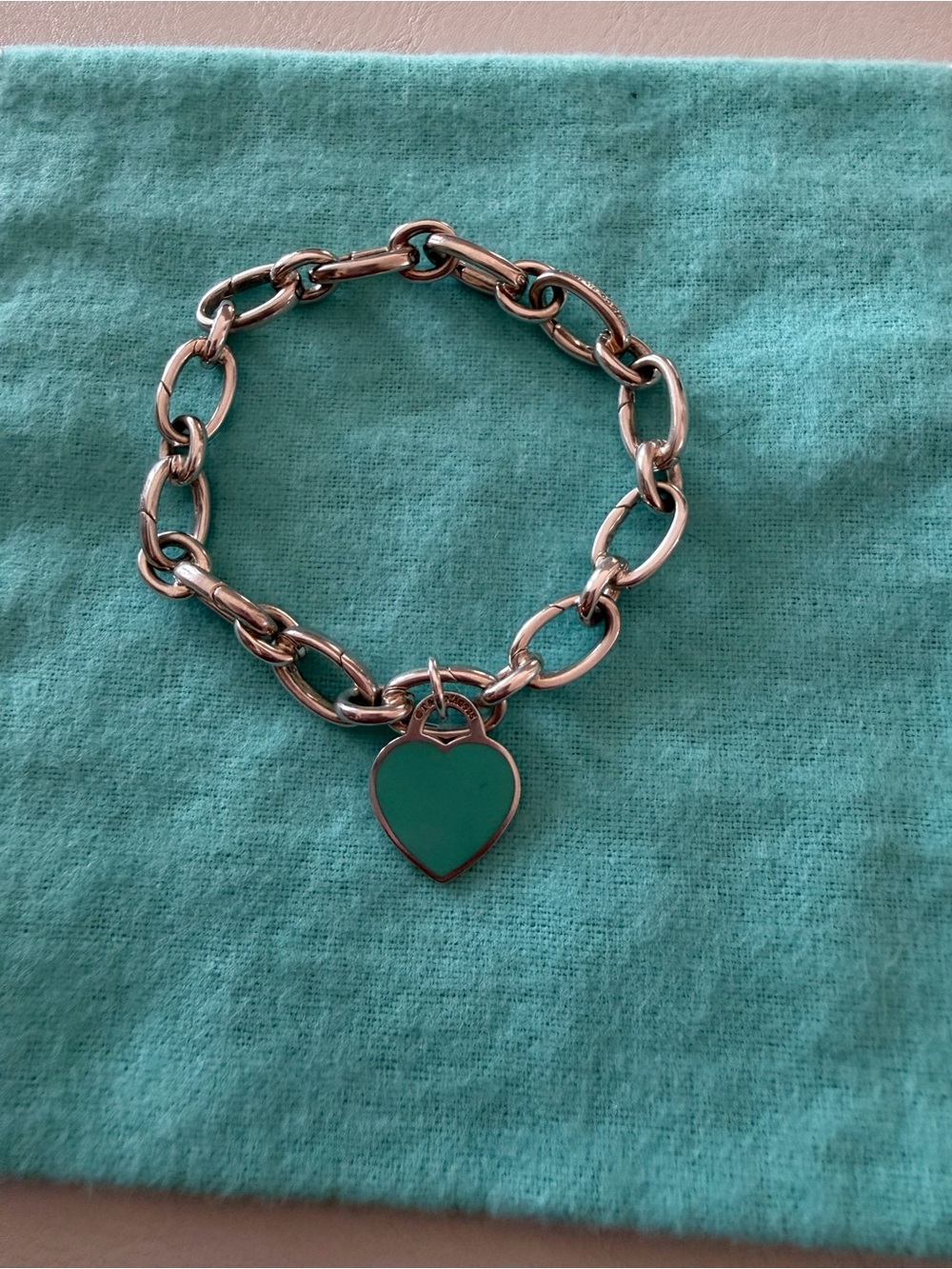 Tiffany & Co clasping link bracelet with heart charm